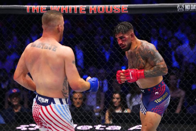 Ilia Topuria and Justin Gaethje during their fight at UFC Freedom 250